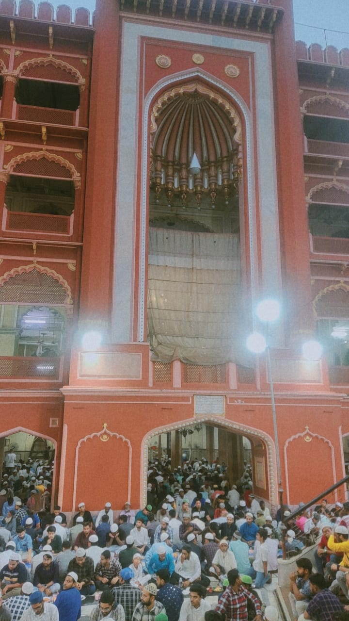People seated for iftar in a mosque during Ramadan